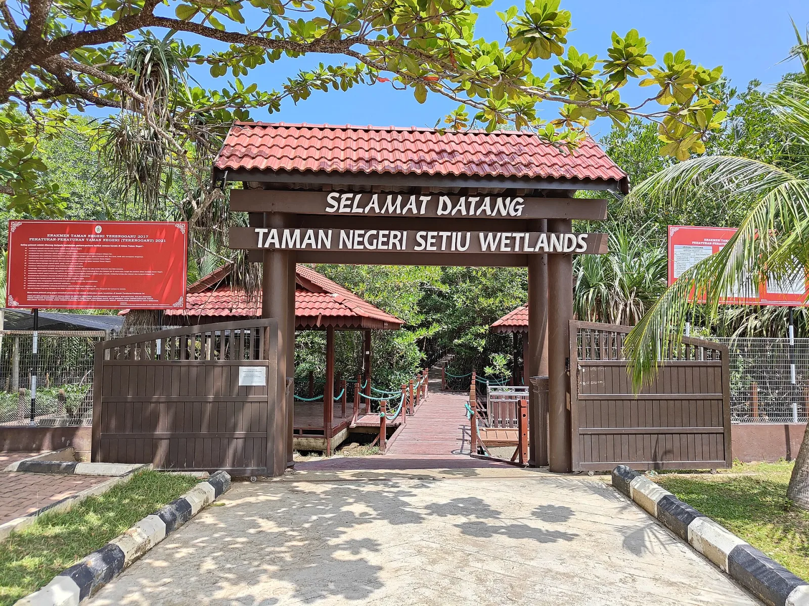 The entrance to Setiu Wetlands State Park surrounded by coastal greenery.