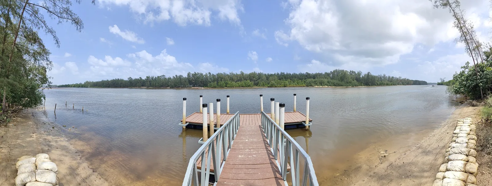 A jetty extending into the calm lagoon at Setiu Wetlands State Park.